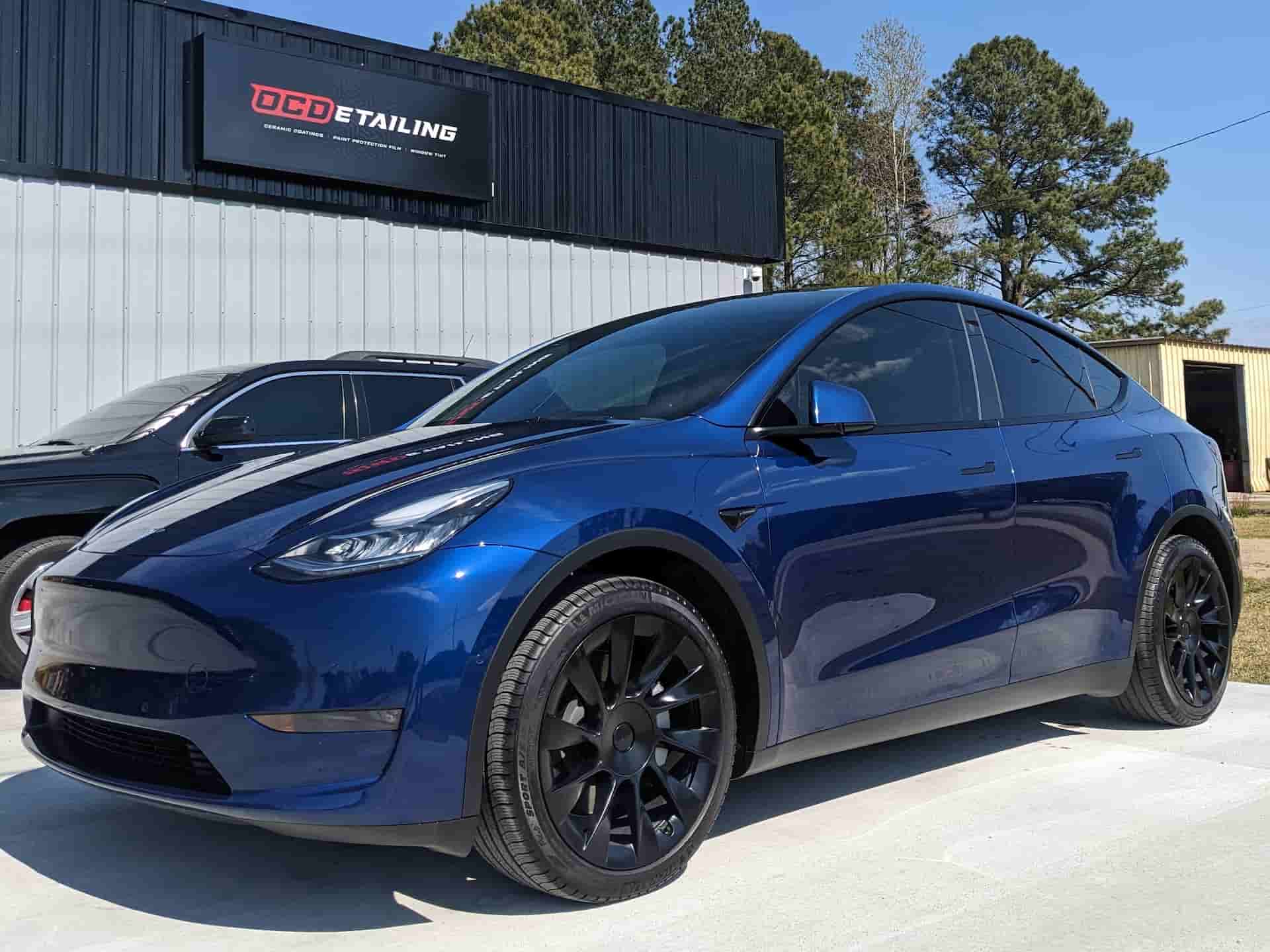 a dark blue car tinted front end