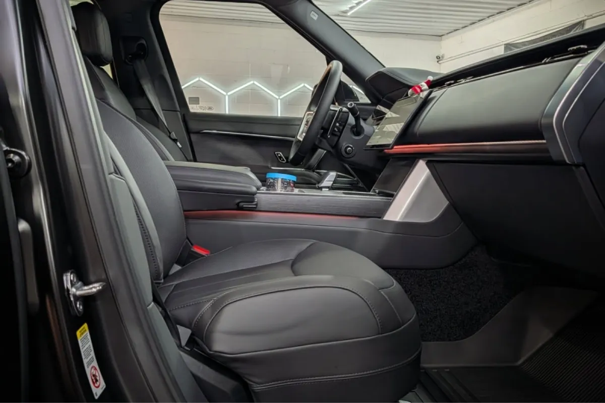 Clean front seat interior after professional car detailing.