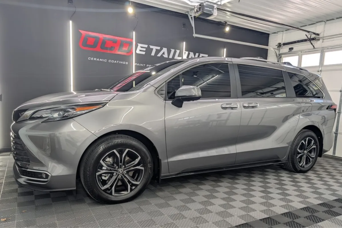Silver Toyota Sienna in a garage with a clean, shiny finish and OCD Detailing branding.
