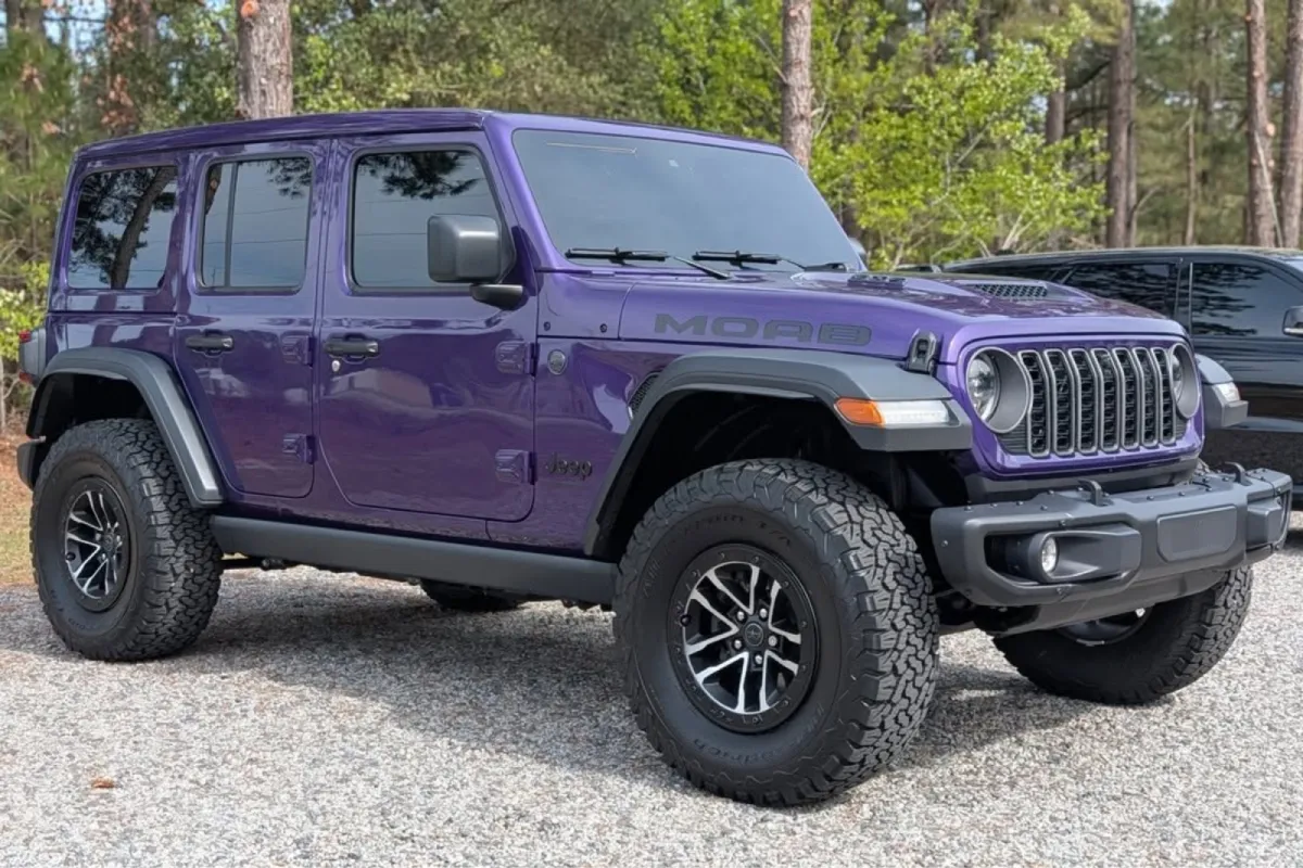 Purple Jeep Wrangler with windshield protection film installed, enhancing glass clarity and durability.